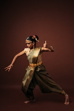 Indian bharatanatyam dancer performing traditional mudra pose