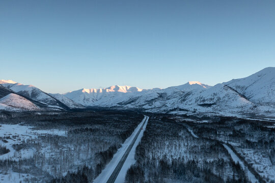 Snowy Highway Through Arctic Valley, Drone Shot