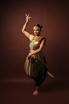 Indian bharatanatyam dancer performing traditional mudra pose