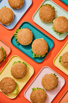 Burgers on Colorful Trays. Finger, fast food background. 