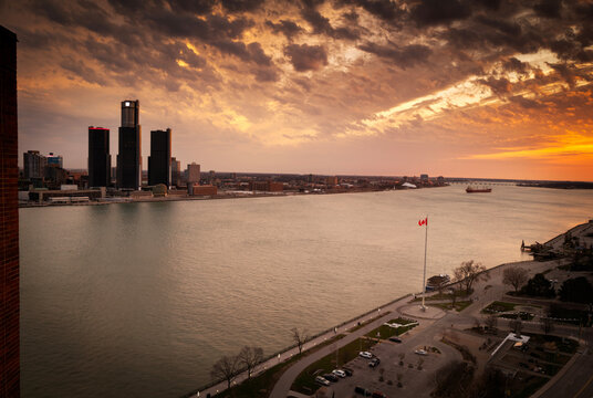 Sunset Over the Detroit River With Buildings in the Background