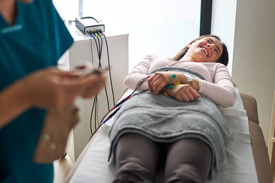 Patient receiving neurostimulation therapy at physiotherapy center