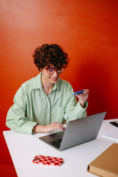 Woman with credit card making payments
