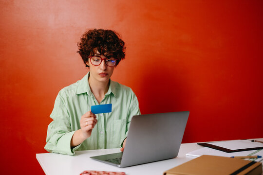 Woman with credit card making payments