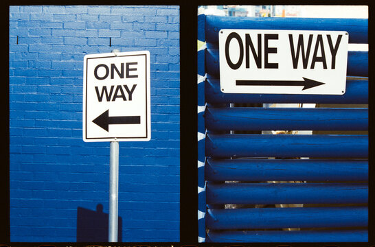 Diptych of Signs Showing One Way Direction in Urban Setting