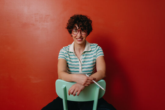 seated smiling young woman
