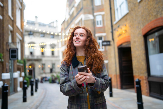 Exploring London with smartphone in hand