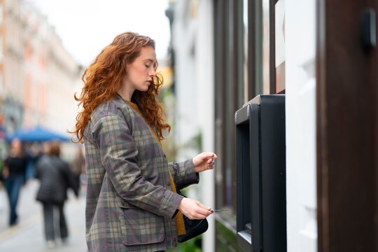 Woman using contactless payment in city