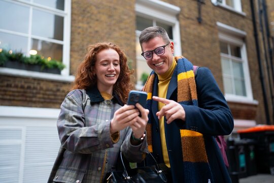 Showing smartphone content together in London