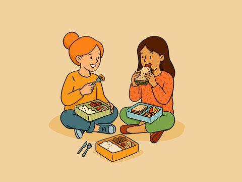 Girls sharing lunch boxes enjoying school picnic meal