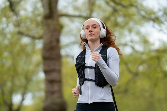 Woman jogging with headphones outdoors