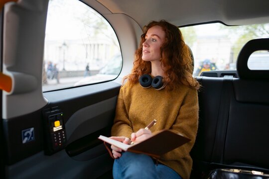 Taking notes while commuting in London taxi