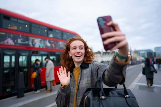 Selfie with London bus and city background