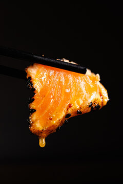 Salmon dipped in sauce
