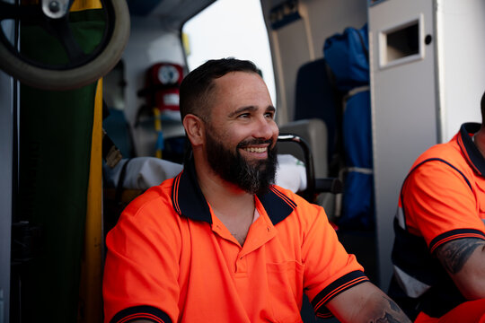 Smiling paramedic man