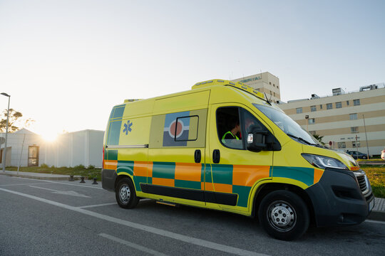 Ambulance van parked outside hospital building