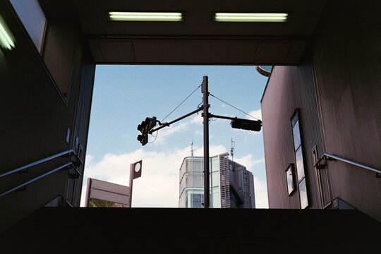 Urban intersection framed by underpass in Tokyo