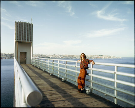 Woman on Lisbon Waterfront Deck