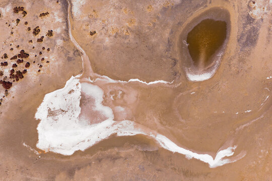 Abstract crusty patterns in the middle of a drying salt lake