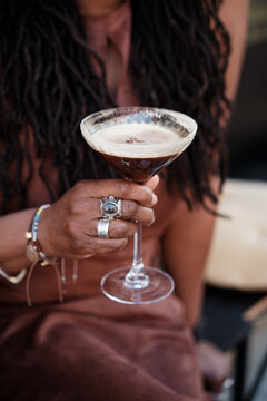 Anonymous woman holding a cocktail 