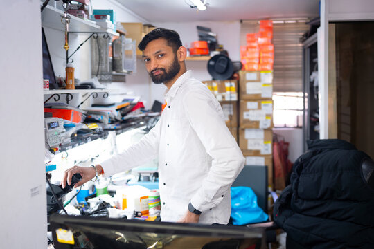 Electronics technician working in repair shop