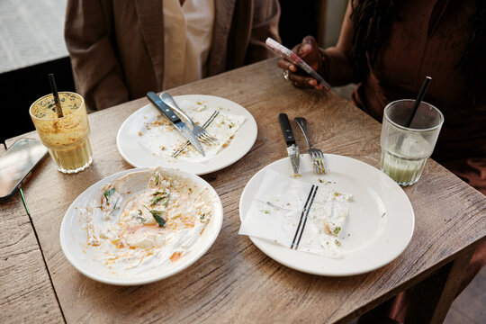 Dirty and empty dishes at table