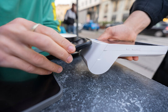 Gen Z traveler enjoying a coffee break in Italy with gadgets