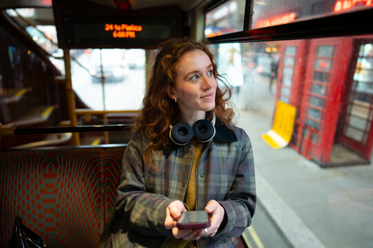 Looking outside while sitting in London bus