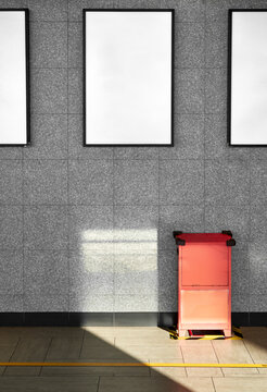 Blank poster frames on subway wall with copy space for branding
