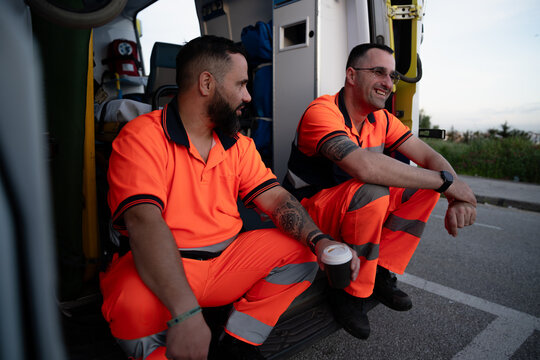 Paramedics resting and drinking coffee