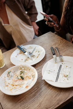 Dirty and empty dishes at table