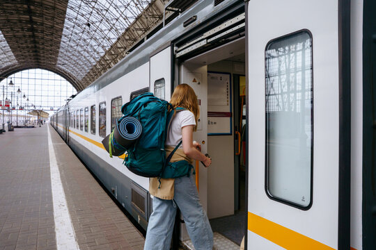 Backpackers at railway station before journey