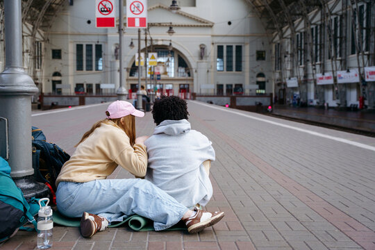 Backpackers at railway station before journey
