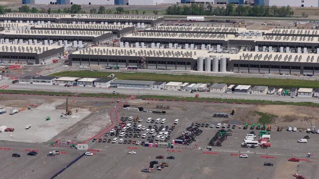 Aerial View of Hyperscale AI Data Center Campus with Cooling Units and Server Buildings, new construction