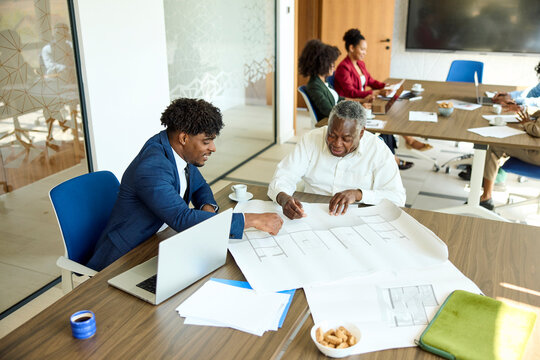 Men Collaborate in a shared office