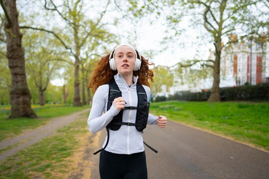 Focused woman jogging outdoors