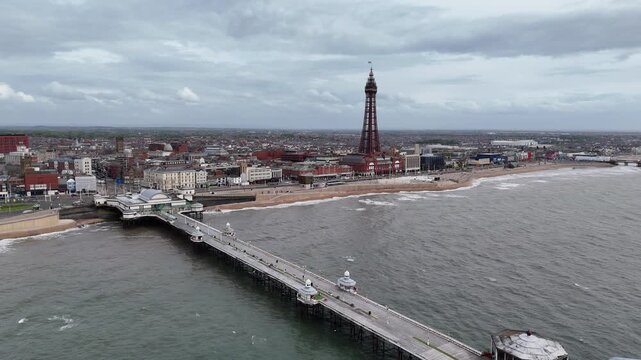 Rising drone aerial from North Pier to Blackpool Tower Lancashire UK