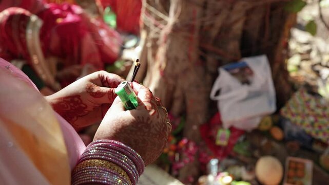 Devotee offering incense sticks for holy religious rituals and festive occasions