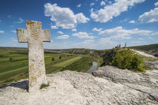 Old christian cross above the historical temple complex of old Orhei or Orheiul Vechi, Moldova