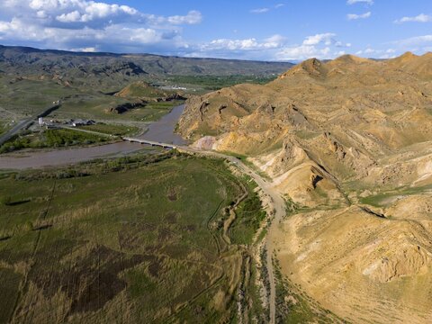 View of river with bridge in mountainous area under clear sky, aerial view, Aras river, mountains at D70 and D80, Tuzluca, Igdir province, Iğdır, Eastern Anatolia, Anatolia, Turkey