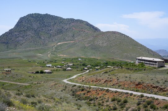 Village in a green hilly landscape under a blue sky, Kərk, Karki or Tigranaschen is a village belonging to Azerbaijan under international law and surrounded by Armenian territory, occupied by Armenia and administered by the province of Ararat, Azerbaijani exclave, M2, Azerbaijan