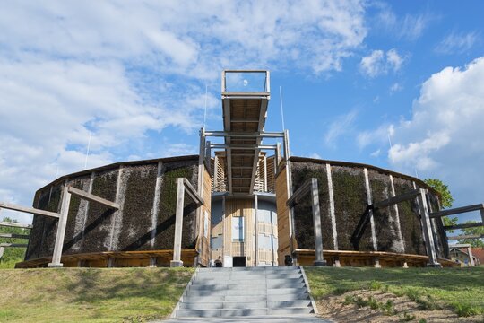 Round building made of wood and metal with stairs, blue sky and green landscape in the background, brine, graduation tower, spa town of Miłomłyn, Milomlyn, Liebem&uuml;hl, Warmia-Masuria, Poland
