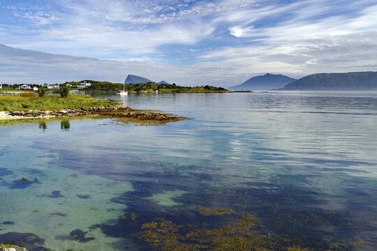 Fine sandy, deserted beach and crystal clear water on Sommar&oslash;y Island, summer, high mountain, tourism, Troms, Troms og Finnmark Province, Norway