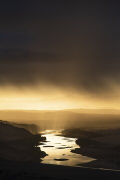 Thunderstorm over the Orange River, also known as the Orange River, on the border between Namibia and South Africa, Oranjemund, Sperrgebiet National Park, also known as Tsau ǁKhaeb National Park, Namibia