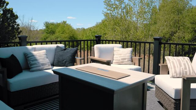 Modern elevated backyard deck suburban house featuring black metal railings and covered patio space in residential neighborhood