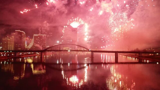 Night fireworks over Belgrade Waterfront and Sava River, Belgrade, Serbia, reflected in water. g.
