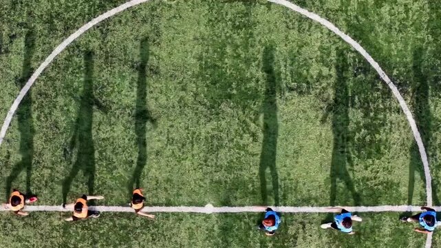 Before the match began, the referee had players from both teams shake hands to emphasize good manners, sportsmanship, and adherence to the rules of the game