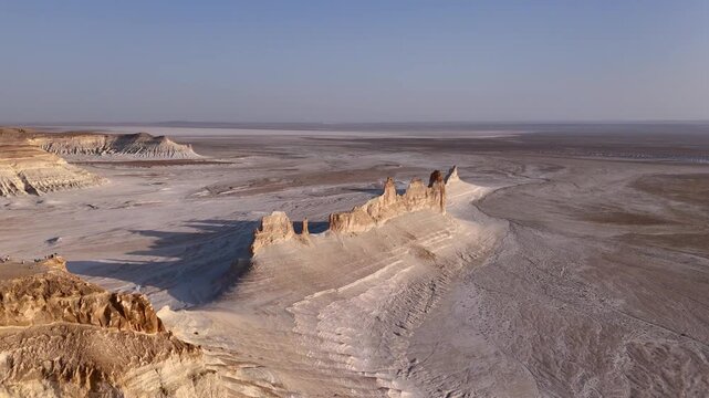 Aerial view of Bozzhyra View Point 1 featuring unique limestone rock formations and vast desert plains in Karakiya District, Mangystau Region, Kazakhstan.