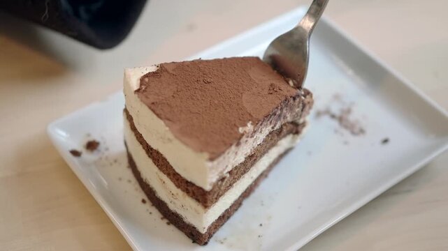 Enjoying a slice of cake at a cafe in the afternoon