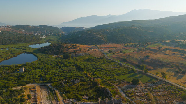 Gelemis, Turkey. Ancient gate, modern roadway and Hurmalik Hamami thermal complex at Tepecik in Patara, historical and contemporary elements. Aerial View